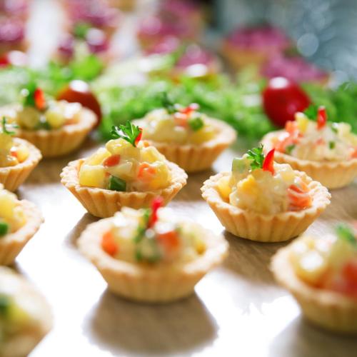 Tartlets with Vegetable Salad on Buffet Table